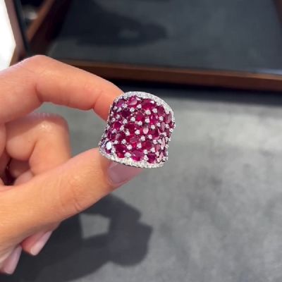 25.5CT Oval Shaped Ruby Saddle Ring with Zircon Prongs