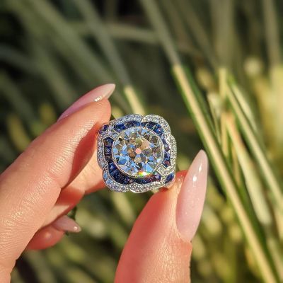 4.4ct Round Cut White Zircon Glistening Alongside Sapphires Vintage Engagement Ring