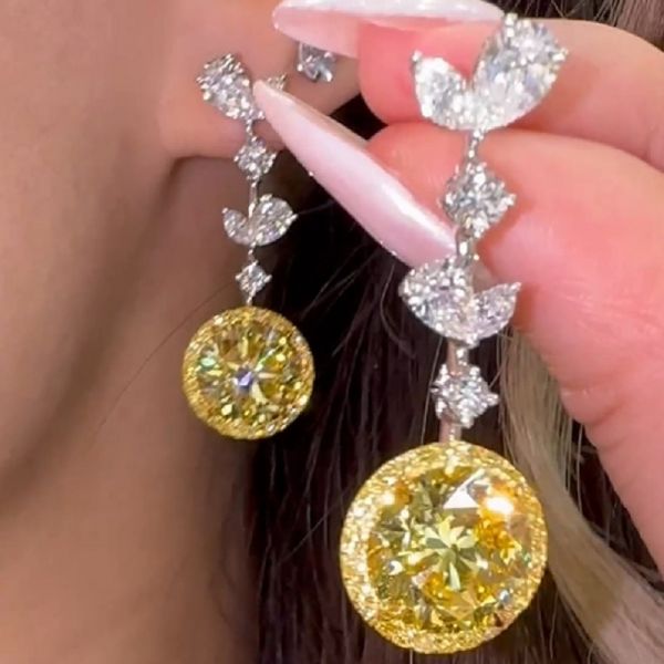 4.8 Carat Each Round Brilliants Fancy Vivid Yellow Earrings