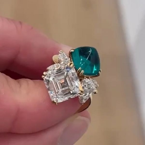 5.82 Carat Zircon And  4.31 Carat Sugarloaf Emerald Split Shank Crossover Engagement Ring