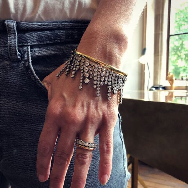 A Side Of Round Cut White Sapphires Yellow Gold Dangle Bangle